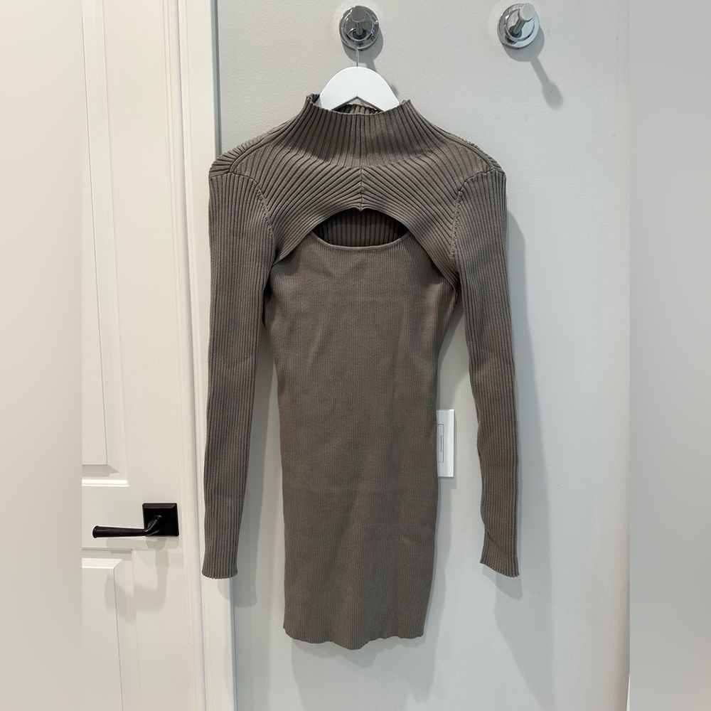 Tight sweater dress. Cut out by chest. Super comfortable. Perfect length.